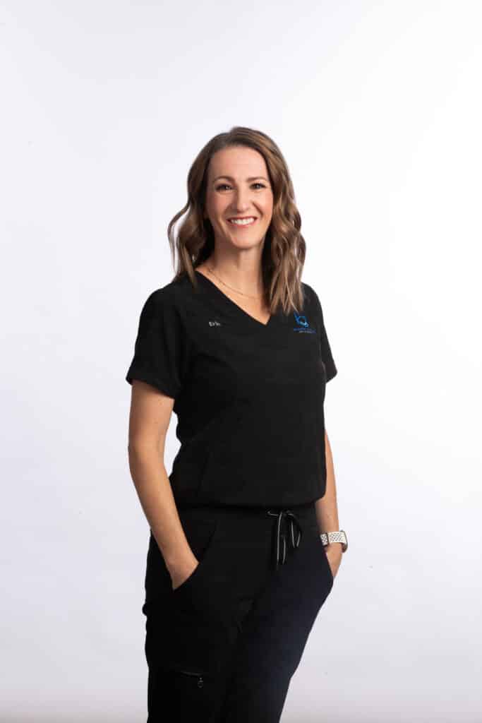 Erin, orthodontic assistant at Brodie Bowman Orthodontics, smiling in black scrubs