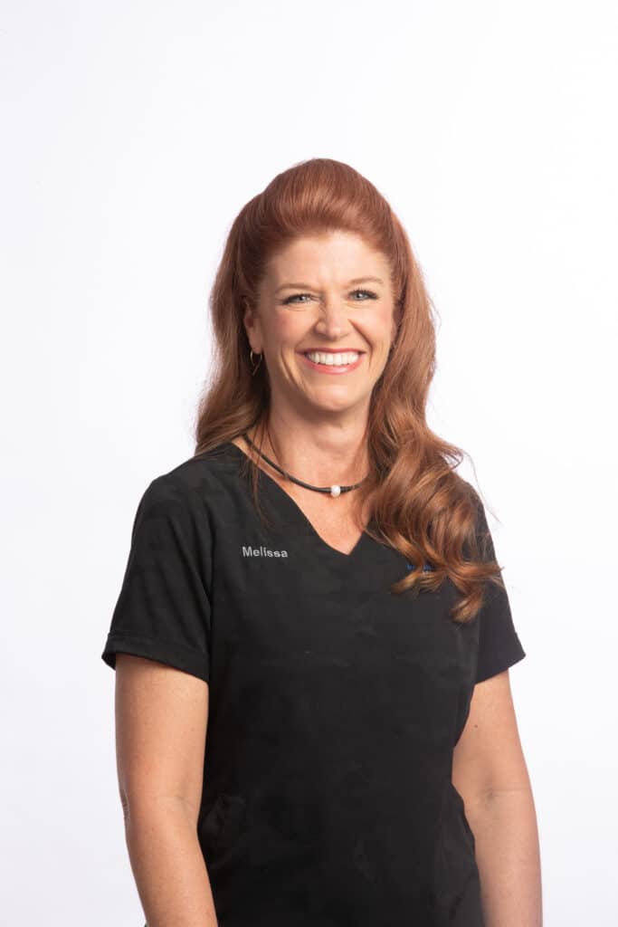 Melissa, orthodontic clinical team member at Brodie Bowman Orthodontics, smiling in black scrubs