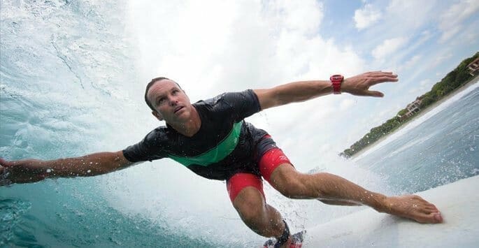 Dr. Brodie Bowman of Brodie Bowman Orthodontics surfing a wave