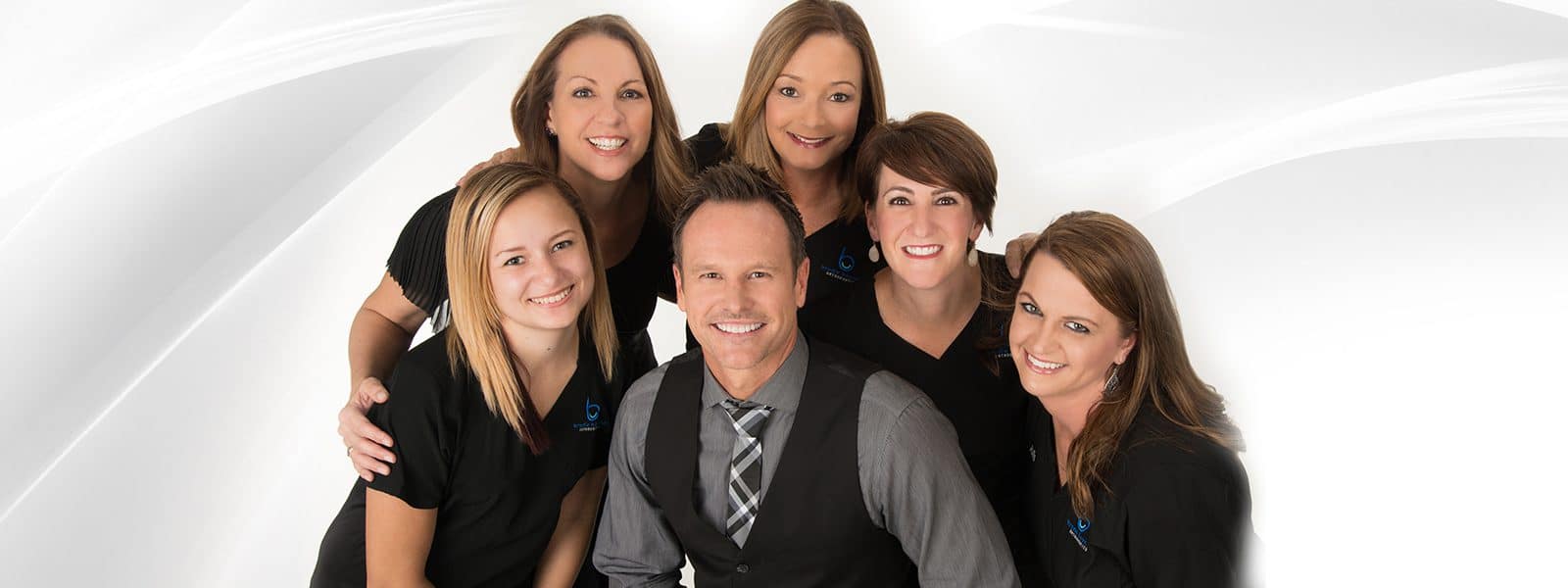 Dr. Brodie Bowman with the Brodie Bowman Orthodontics team in a studio group portrait